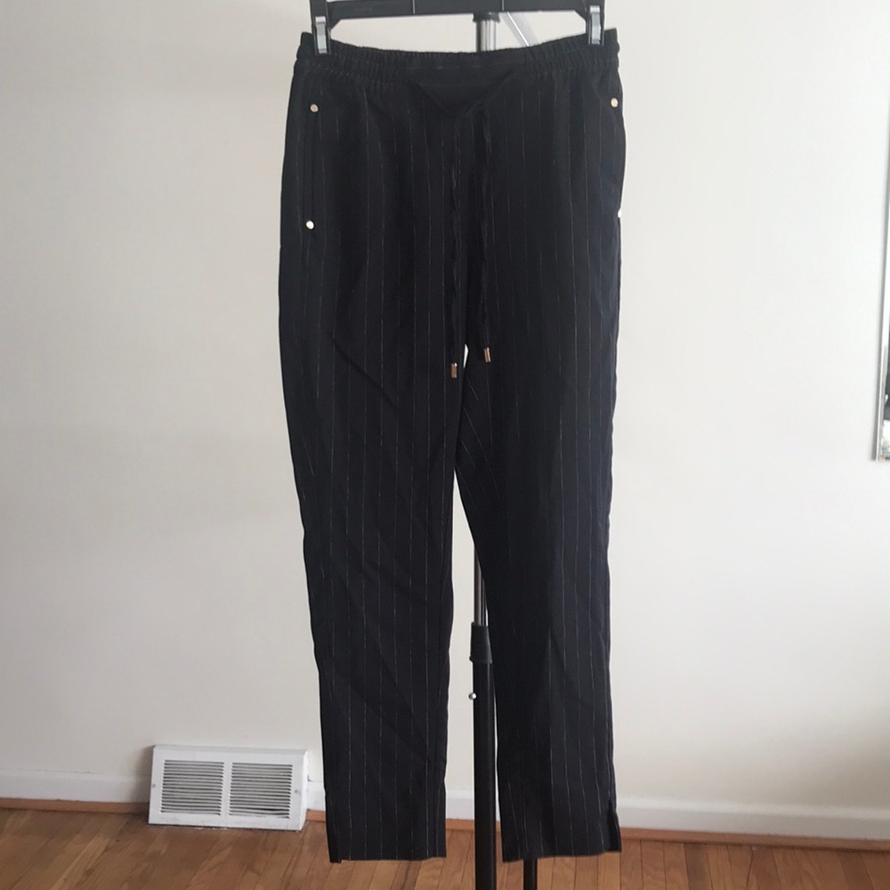 H&M black pin-striped trousers.